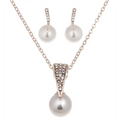 Silver-toned bride rhinestone pearl necklace with triangular crystal pendant and single white pearl drop for bridal wear