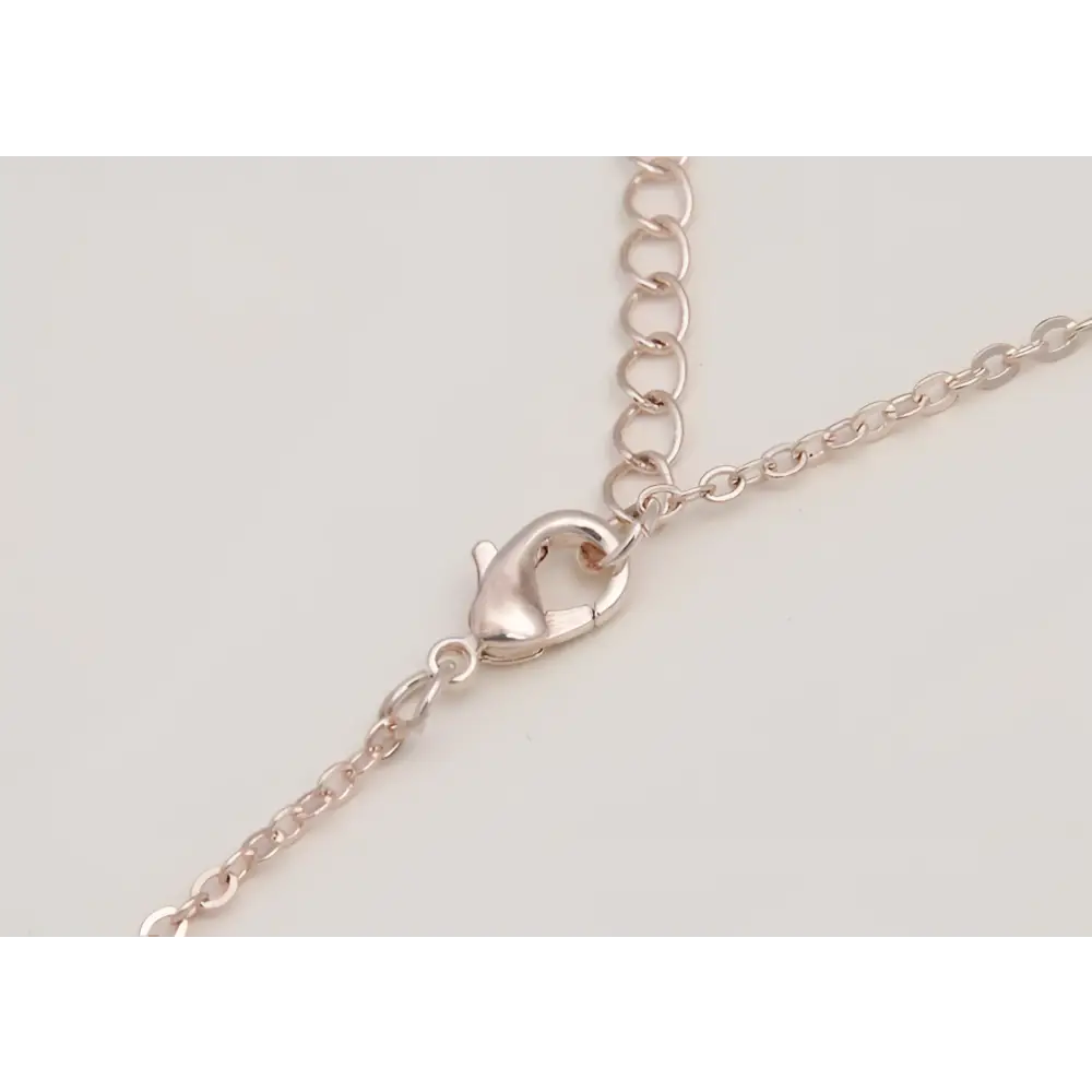 Rose gold-toned lobster clasp attached to a delicate chain of bride rhinestone pearl earrings necklace set