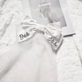 White satin bow embroidered with bride to be in black script featuring diamond detail for minimalism fashion wedding decoration