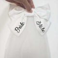 White satin bow with bride and to be printed in black cursive for minimalism fashion wedding decoration