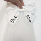White satin bow with bride and to be printed in black cursive for minimalism fashion wedding decoration