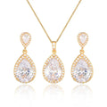 Gold-toned bright big zircon water drops pendant necklace and matching earrings set with central clear crystal and pave stones