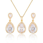 Gold-toned bright big zircon water drops pendant necklace and matching earrings set with central clear crystal and pave stones