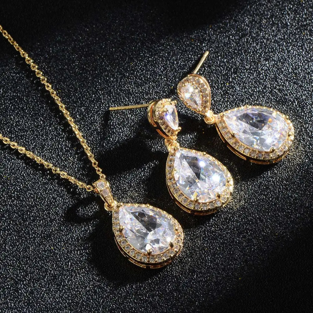 Elegant gold-toned bright big zircon water drops jewelry set with teardrop pendant necklace and matching earrings featuring clear crystals