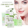 Spring tree cbd brightening moisturising skincare set with five translucent green bottles including cleanser toner lotion serum oil