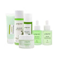 Spring tree cbd brightening moisturising skincare set with translucent green bottles and a white jar minimalist labeling