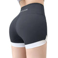 Black high waisted hip lifting sports shorts with white trim and subtle nychome logo on waistband perfect for yoga pants stitching