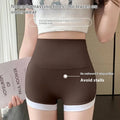 Brown high waisted hip lifting sports shorts with white trim and detailed stitching yoga pants design