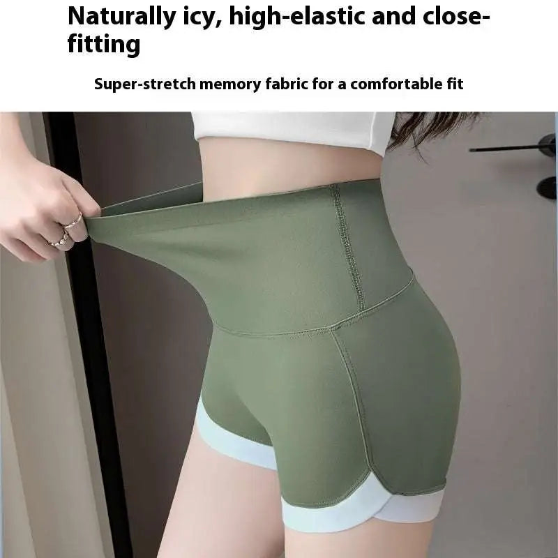 Brown high waisted hip lifting sports shorts in olive green with light blue trim and super-stretch memory fabric waistband