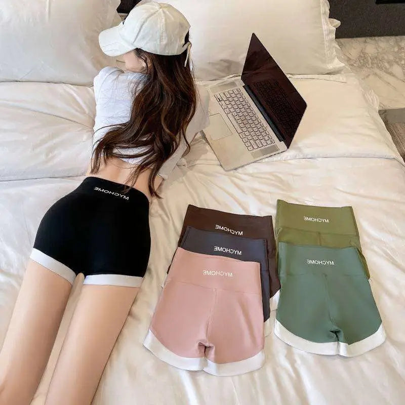 Black high waisted hip lifting sports shorts with white trim and mychome branded waistband for lifting sports use
