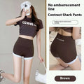 Brown high waisted hip lifting sports shorts with white trim and contrast stitching yoga pants design