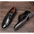 Black leather oxford dress business shoes with polished finish and brogue detailing for formal wear