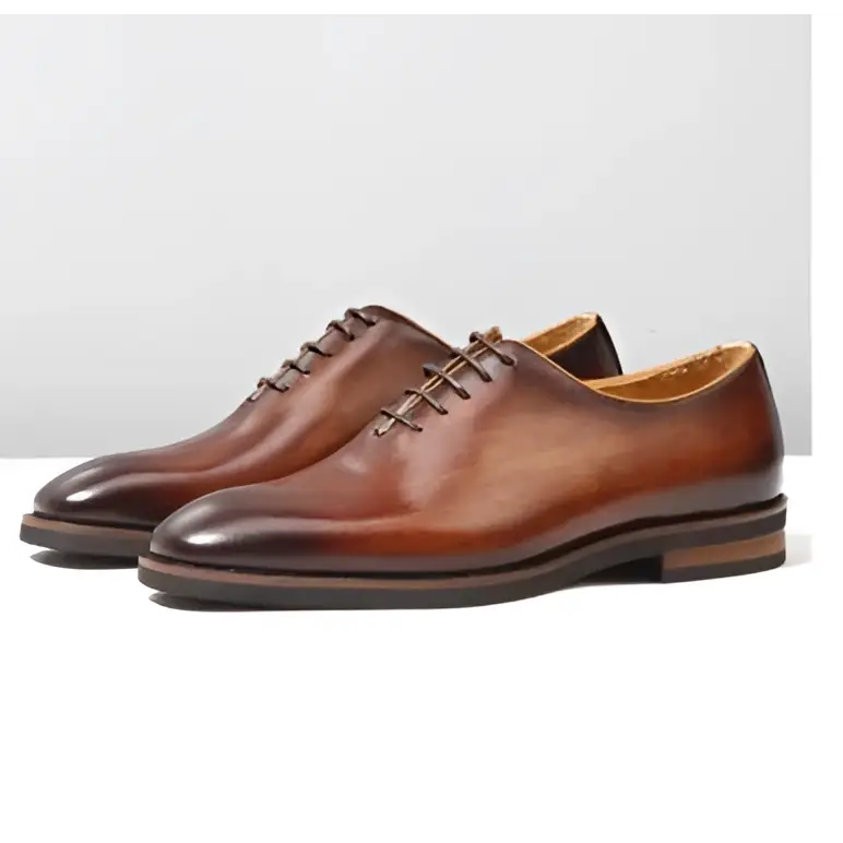 Brown leather oxford shoes for men with classic pointed toe polished finish ideal as wedding shoes
