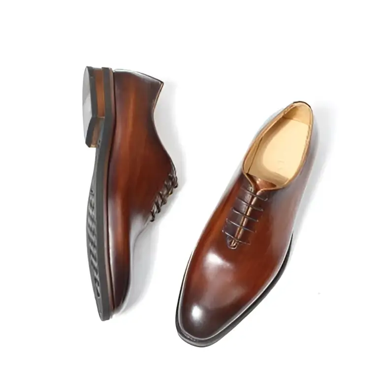 Polished brown leather oxford shoes for men with classic pointed toe and lace-up design ideal as wedding shoes