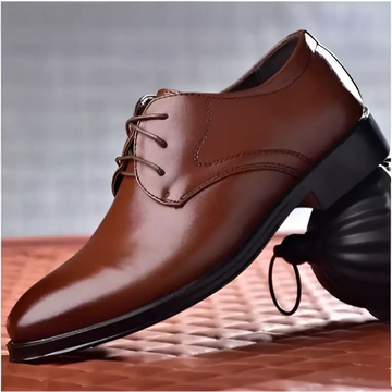 Brown pointed toe leather shoes with black rubber sole and laces ideal for luxury women’s fashion events