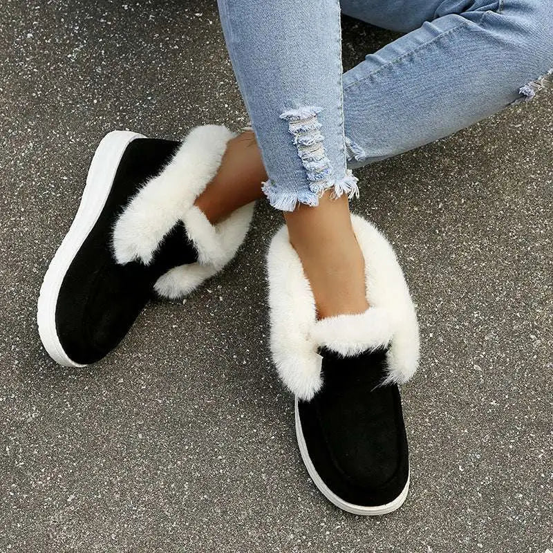 Black suede warm winter slip-on boots with plush white faux fur lining and thick white rubber sole warm winter shoes
