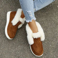 Brown suede warm slip-on boots with plush white faux fur trim and thick white rubber sole for warm winter shoes