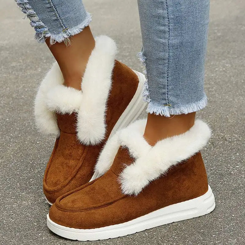 Brown suede warm winter shoes with white faux fur trim and chunky white sole for cold weather wear