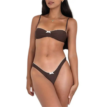 Brown y2k bikini set with delicate white bow accents and thin straps featuring coquette bikini style details