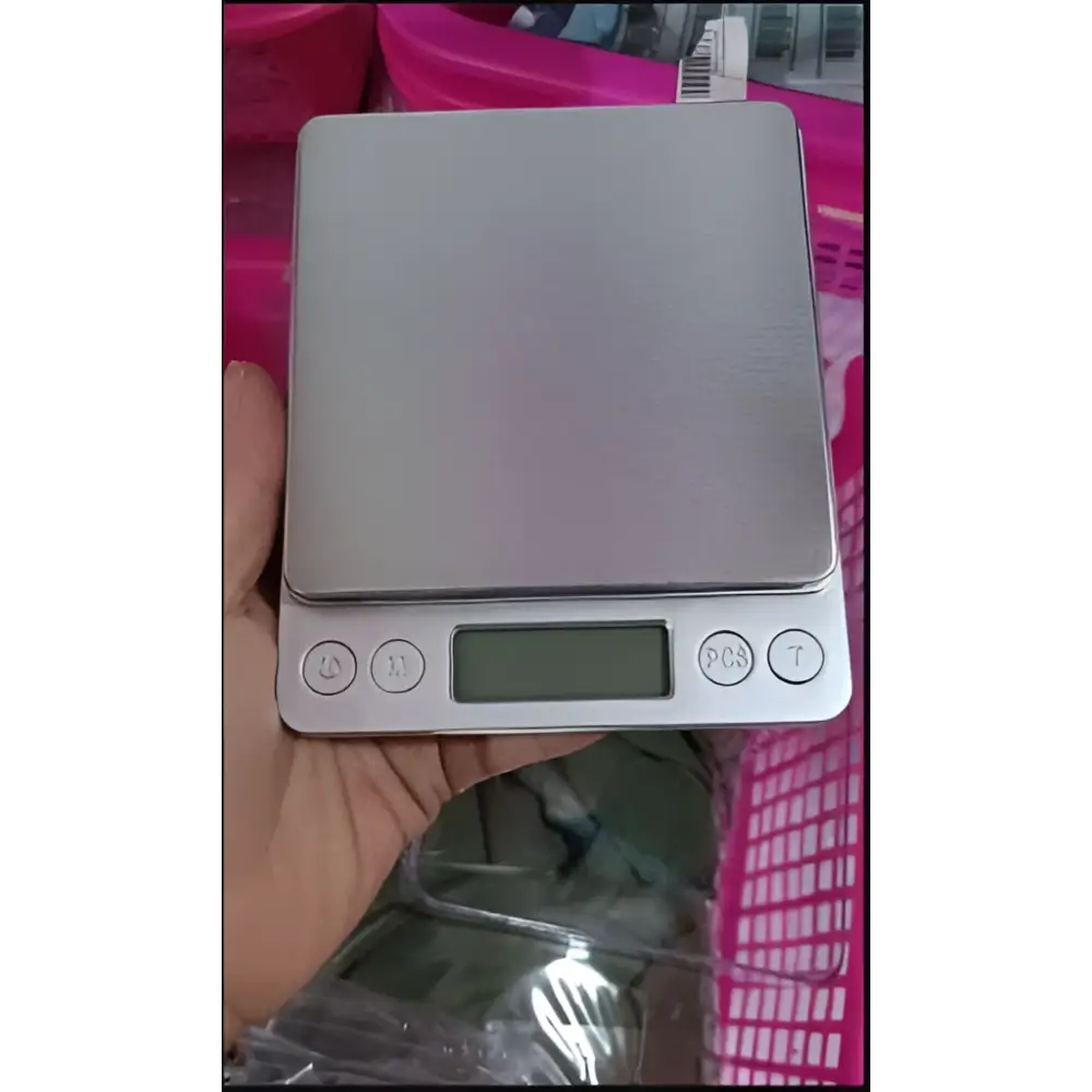 Brushed stainless steel food portable mini pocket scale with silver rectangular platform and four circular buttons below display