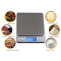 Silver mini pocket scale with brushed stainless steel surface and blue led display for food portable mini use