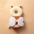 Cream and brown plush bee-shaped toddler head protection pad with white wing accents and bunny ear mesh design