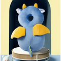 Blue plush dragon shaped neck pillow with yellow accents designed for toddler head protection and bunny ear mesh pad