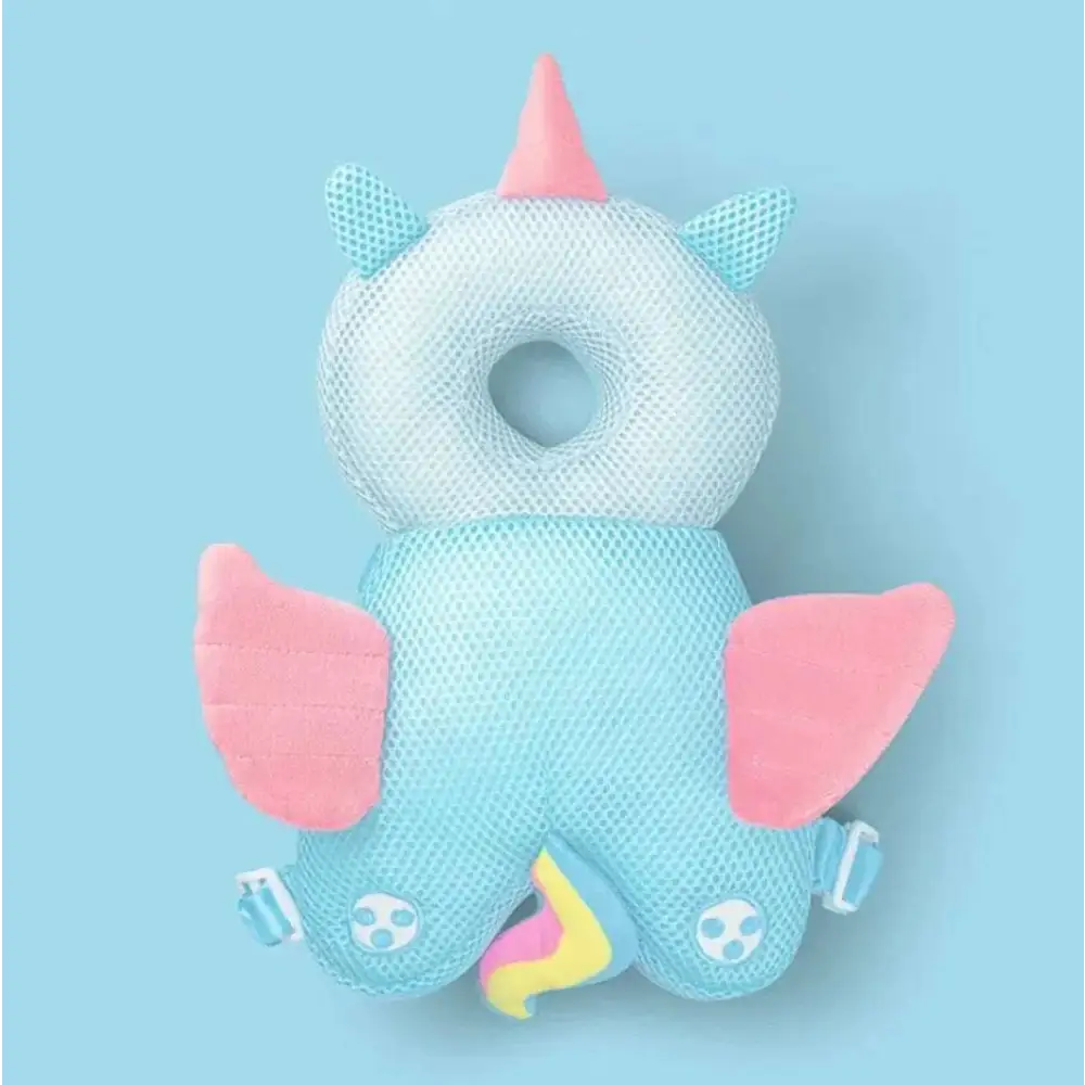 A soft light blue bunny ear mesh toddler head protection pad shaped like a unicorn with plush wings and colorful tail
