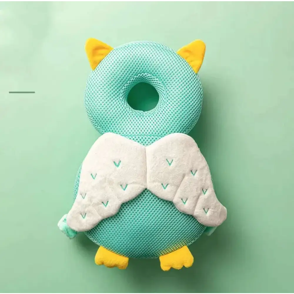 Bunny ear mesh toddler head protection pad in soft teal mesh with yellow felt accents and embroidered white wings