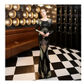 A shimmering black and silver long sequin dress with fashion stitching mopping in mermaid style and long sleeves