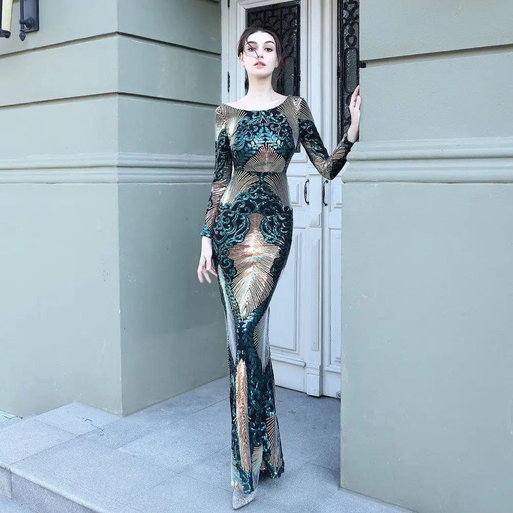 Burgundy gold mopping long sequin dress with a fitted silhouette, long sleeves, and intricate floral fashion stitching mopping patterns