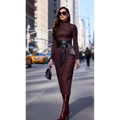 A sleek burgundy high neck midi belted dress with a fitted silhouette and wide-waisted black leather belt