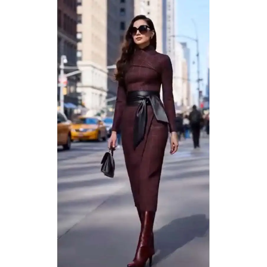 A sleek burgundy high neck midi belted dress with a fitted silhouette and wide-waisted black leather belt