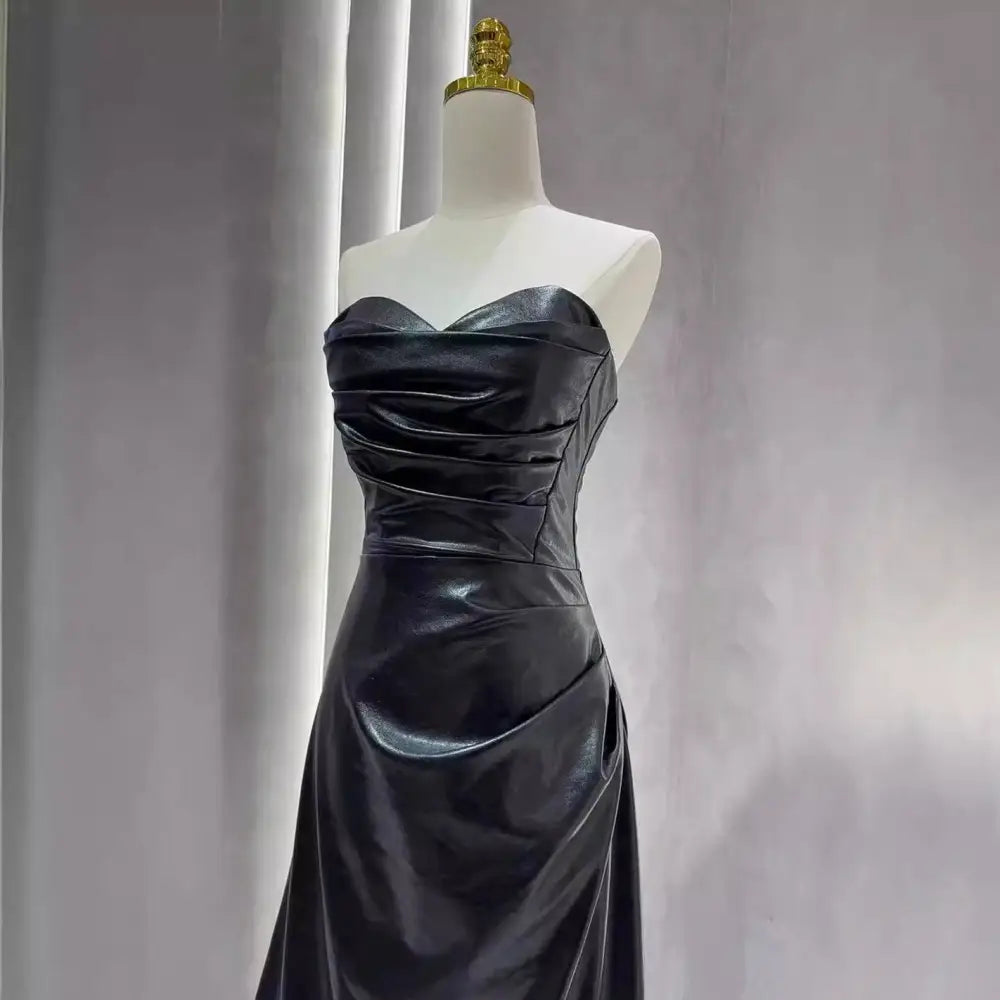Black satin strapless skirt evening gown with fitted bodice and flowing skirt for elegant evening wear