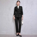 Black tailored blazer with belted waist and long sleeves as part of burgundy long sleeve sleeve small suit two piece set