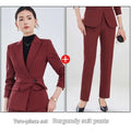 Burgundy long sleeve two piece set featuring a tailored blazer with belted waist and matching slim-fit pants