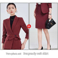Burgundy long sleeve two piece set featuring a tailored skirt suit with matching waist belt and sleeve small suit design