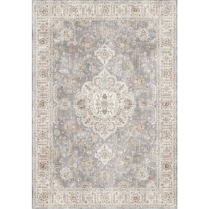 Burgundy ornate short pile area rug in gray and cream with intricate floral and geometric vintage-style patterns