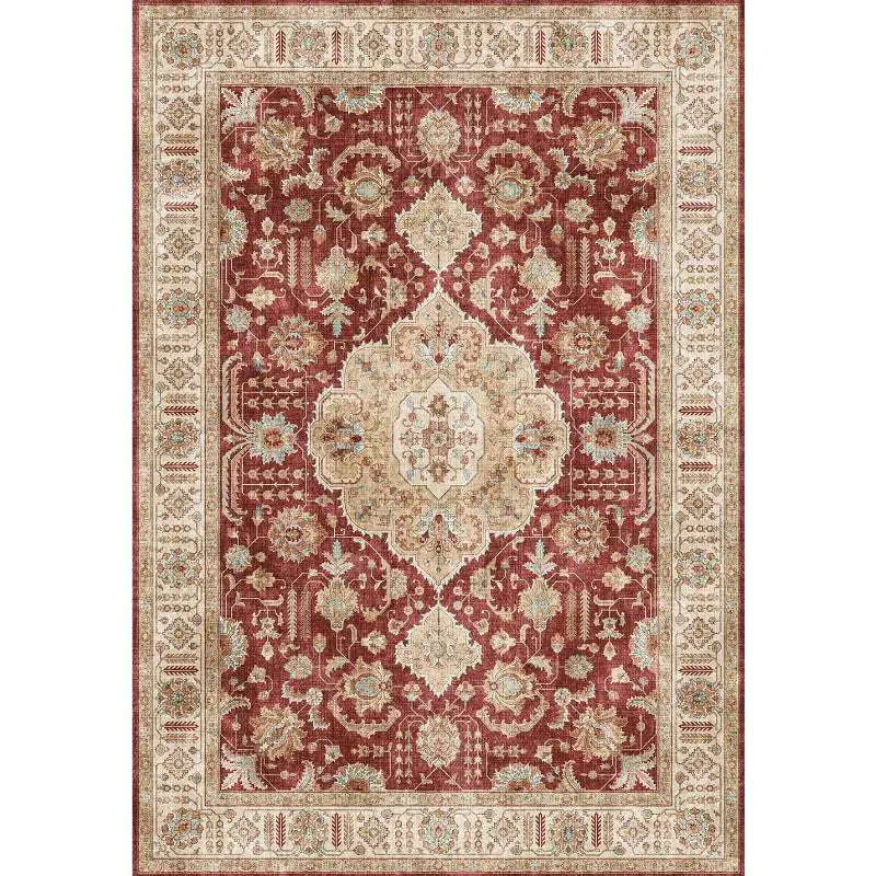 Burgundy ornate short pile area rug with intricate floral and geometric patterns in rich burgundy and cream colors