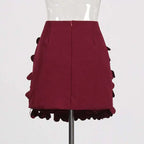 A structured burgundy petal design sense stitching a line skirt with layered ruffled fabric details and stitching wafer accents