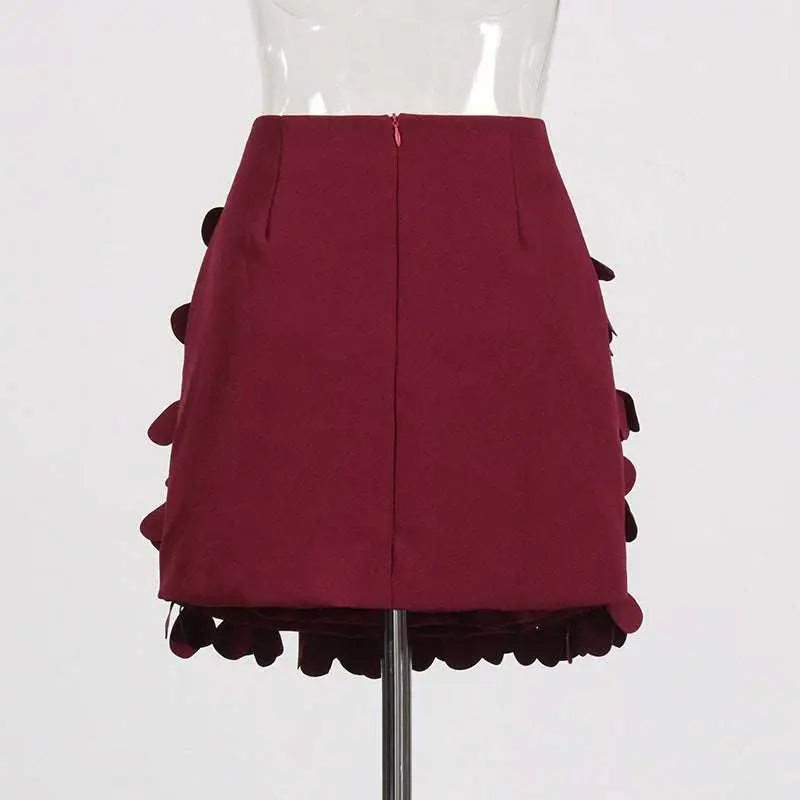 A structured burgundy petal design sense stitching a line skirt with layered ruffled fabric details and stitching wafer accents