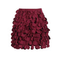 A burgundy a line skirt featuring layered petal fabric appliqués and intricate design sense stitching wafer details