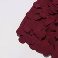 Burgundy petal design a line skirt featuring rich fabric with overlapping scalloped appliqués and design sense stitching wafer
