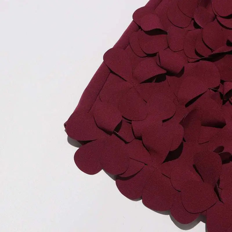 Burgundy petal design a line skirt featuring rich fabric with overlapping scalloped appliqués and design sense stitching wafer