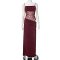 A burgundy satin y2k lace suspender dress featuring a lace bodice and draped skirt in a satin material