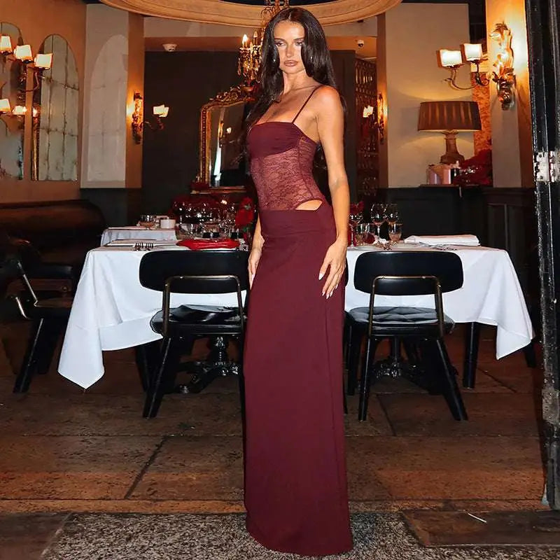A burgundy satin y2k lace suspender dress featuring a lace bodice with cut out details and a flowing skirt