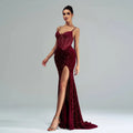 A burgundy sleeveless sequined evening dress with lace bodice and a sequined high slit for formal occasions