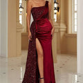 A glamorous burgundy velvet single strapless evening dress with a sequined bodice and high slit velvet skirt