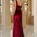 Luxurious burgundy velvet evening dress with one-shoulder design and sparkling sequin detailing on the back view