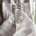Back view of a white satin bustier korean princess beaded tulle wedding dress with lace-up ribbon detail